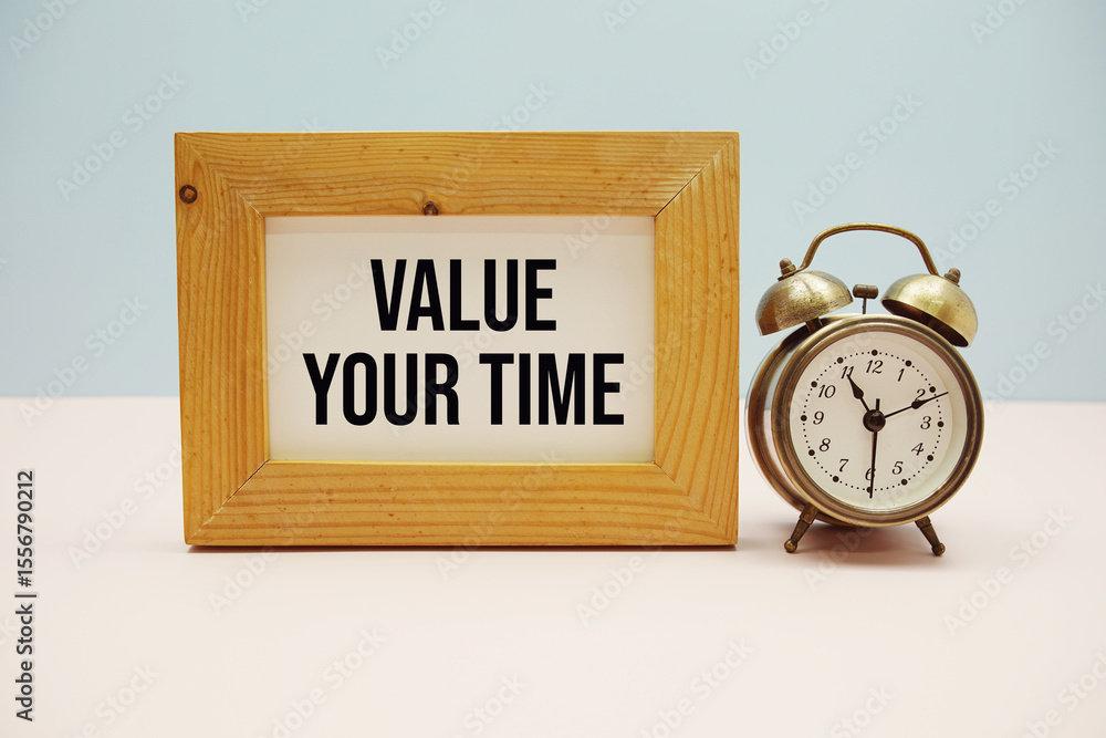 Poster value your time text with alarm clock on blue and pink background