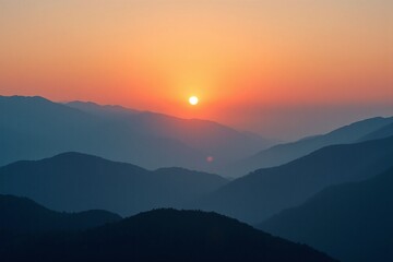 Obraz premium Sunrise Over Misty Mountain Layers with Warm Tones