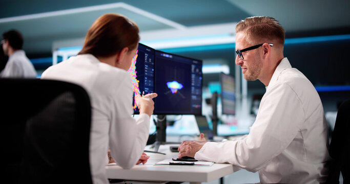 Team Of Analysts Using 3D Software For Research