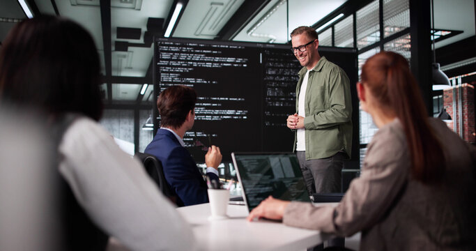 Businesswoman Presenting Website Project To Diverse Team