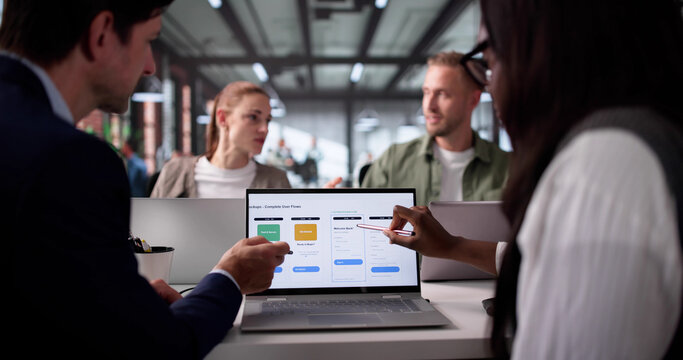 Multiethnic Team Of UI UX Designers Developing Mobile Shopping