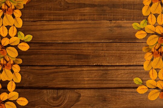 Fototapeta Showcasing rustic wooden plank surface with autumn leaf clusters framing sides in flat design