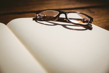 Close-up of eyeglasses at desk