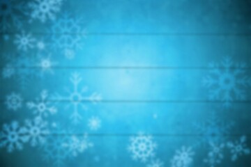 Blurred snowflakes on blue planks