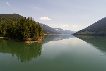 Trees on mountain range by river