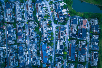 Aerial view of a dense modern residential neighborhood with villas and townhouses in a suburban...