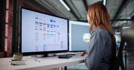 Young Woman Is Working As A Freelance Mobile App UI Designer. She Is Online