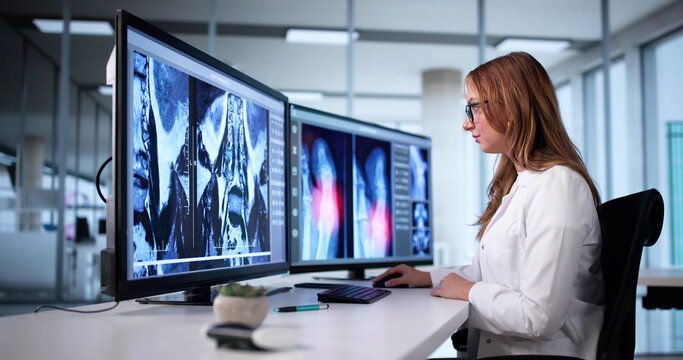 Female Radiologist Analyzing X-Ray Images