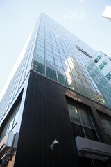 Obraz premium Low angle view of glass building against sky