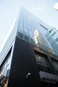 Fototapeta Low angle view of glass building against sky