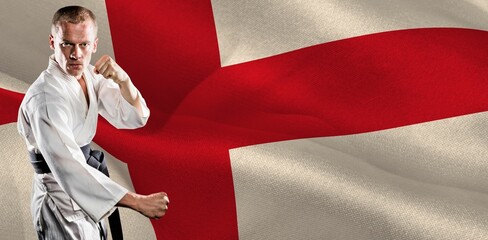 Portrait of martial artist practicing against English Flag