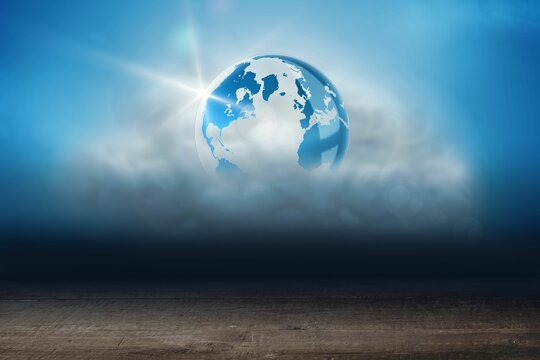 Fototapeta Stylized Earth globe is emerging from clouds above wooden plank in flat design, casting sun flare