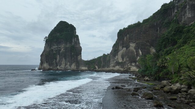 Nestled in the heart of Pacitan, East Java, Pangasan Beach (Pantai Pangasan) is a hidden paradise that defies the typical definition of a tropical coast. Unlike standard sandy shores, Pangasan offers 