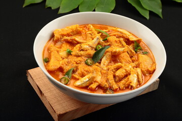 Bowl of delicious coconut mango anchovy fish curry.