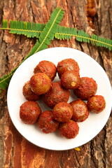 Homemade spicy  gooseberry pickle - Amla Achar- Indian recipes background. 