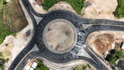 Bundaran Gunungkidul, a prominent roundabout located in Gunungkidul Regency, Yogyakarta, Indonesia. It serves as a central point for traffic flow in the area and is a recognizable landmark.