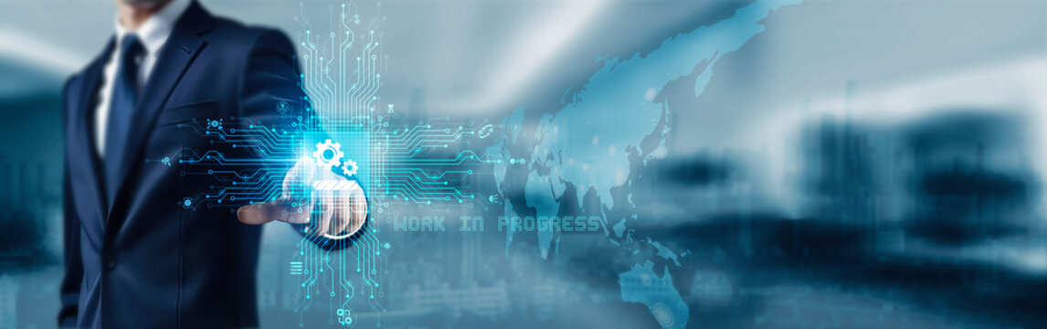 Businessman touching icon and word Work In Progress on digital touchscreen display indicating ongoing project development and active business operations in real-time environment.