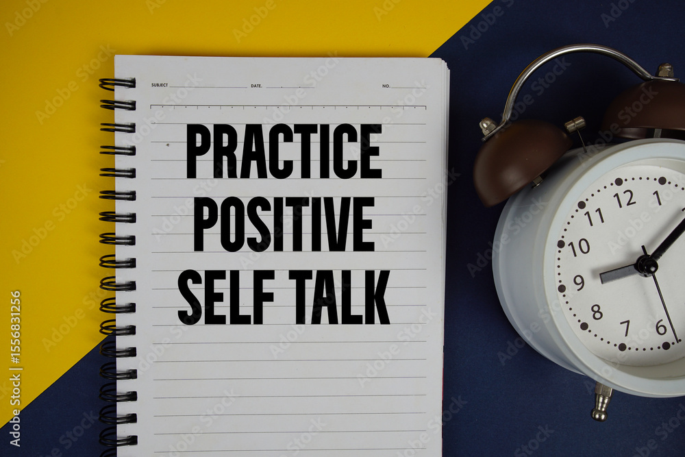 Poster practice positive self talk text written on notepad with alarm clock on yellow background