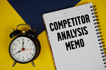 Competitor Analysis Memo text written on notepad with alarm clock on yellow background