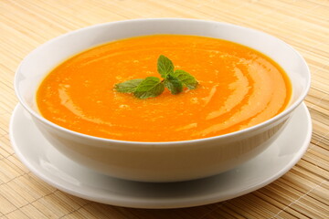 Bowl of delicious organic pumpkin cream soup. 