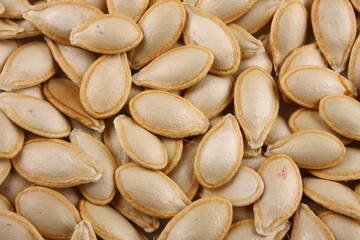 Healthy vegan diet snack food - roasted pumpkin seeds.