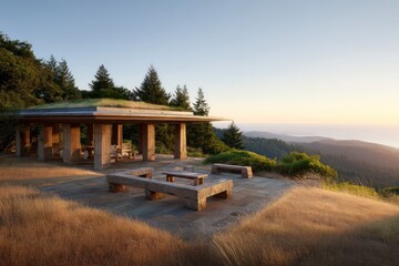 Obraz premium A grand hillside property a grass-roofed pavilion with carved stone benches surrounded by meadow terrain captured with golden