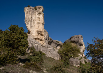 Fototapeta premium A rock against the sky on a summer day.