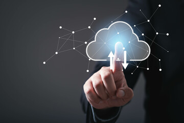 A person interacts with a digital cloud interface, symbolizing data transfer and connectivity in a...