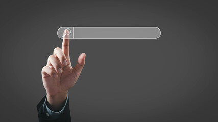A finger points to a transparent search bar against a dark background, symbolizing technology and...