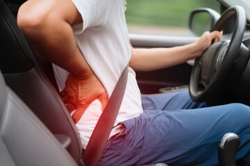 Driver experiencing back pain while navigating through traffic, emphasized by vibrant red tones highlighting discomfort and tension