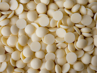 White chocolate chips Pistols buttons. Confection and pastry concept.