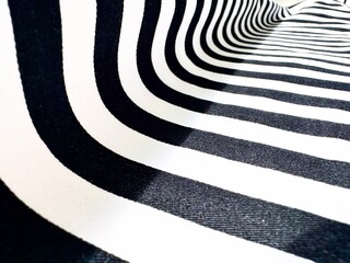 The background is white with black stripes