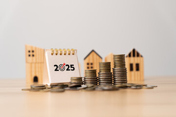 Real estate financial planning for 2025 with growing stacks of coins and miniature wooden houses, representing property investment, housing finance, saving money, and building long-term wealth, assets