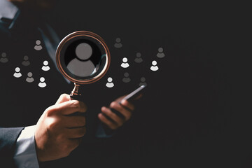 Concept of human resource recruitment visuals of magnifying glass highlighting ideal candidate icon, symbolizing process of headhunting, talent acquisition, employee selection, effective hiring.
