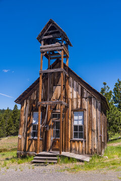 Old wooden one room school house in in a n old western ghost town.