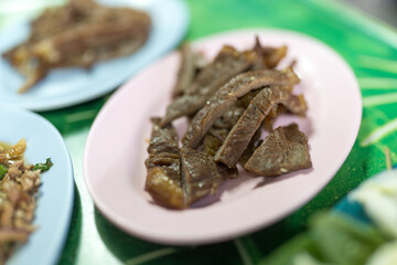 Beef sliced grilled served on pink dish