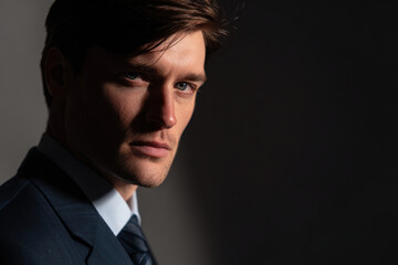 Obraz premium portrait of hydro engineer in formal business suit focusing on eyes and concentrated expression