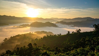 Naklejka premium Beautiful golden sunrise and sunset paint the sky over the mountains, a vibrant landscape of nature and clouds kissed by the morning light and evening mist