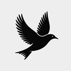 Fototapeta premium Black Bird Silhouette with Wings Spread on Light Gray Background