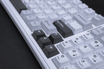 Minimalist photograph of a modern white and black computer keyboard for tech articles blog posts or...