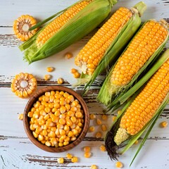 top view of corn cobs with corn pop cereals and corn seeds on wooden background