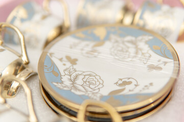 Elegant photographic close-up of vintage floral tea set for lifestyle poster design home decor or...