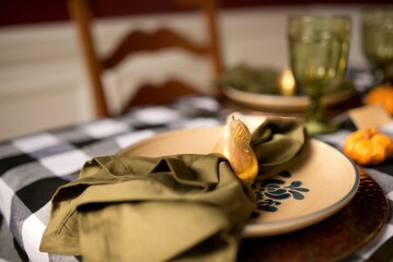Golden pear napkin ring adorning festive fall table setting