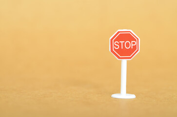 Red STOP Sign on White Pole Emphasizing Halt and Attention in Minimalist Setting