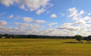 Landscape with blue sky and clouds