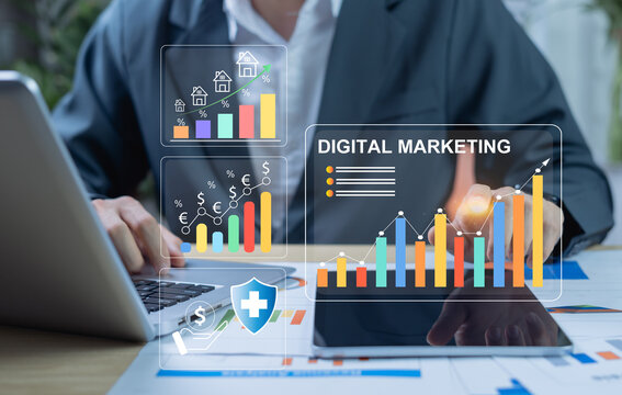 Businessman using laptop and tablet with digital fintech interface showing investment management, online banking, currency exchange, savings, and financial strategy icons.