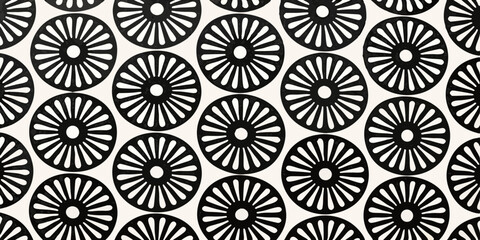 Seamless pattern of black sunburst flower shapes on a white background