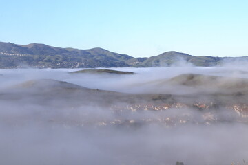Hills rising like islands above the fog in San Ramon, California