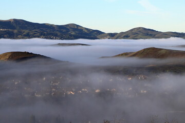 Hills rising like islands above the fog in San Ramon, California