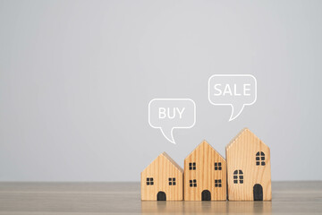 Three wooden houses with speech bubbles showing 